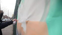 Anonymous graffiti artist spray painting wall News Clip