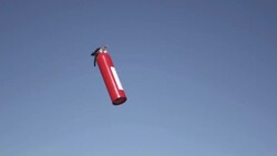 Slow Motion of Tossing Fire Extinguisher Stock Footage