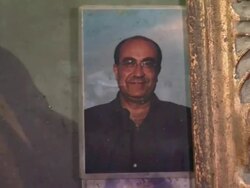 Close-up shots of materials in the underground church the dead in Naples with skulls, candles, pictures, and rosaries in compartments in walls Stock Footage