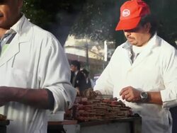 MS Street vendors cooking kabobs in park in Santiago / Santiago, Chile Stock Footage