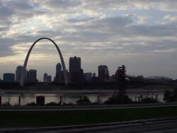 WS PAN View of St. Louis skyline and Gateway Arch at sunset / St. Louis, Missouri, United States Stock Footage