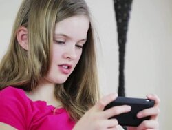 Pretty young teenage girl sending text message Stock Footage