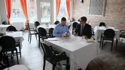 Restaurant owner discusses business with financial advisor Stock Footage