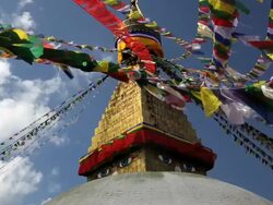Prayer flags flying from the  Boudhanath Stupa, a place of holy worship, Kathmandu, Nepal, Asia Stock Footage