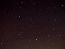 HD Motion Time-Lapse: Cloudscape Against Stars Stock Footage