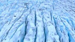 Cracks cover the surface a glacier in Alaska. Stock Footage