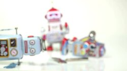 Three broken toy robots Stock Footage