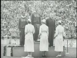 Adolf Hitler salutes at the opening ceremonies for the 1936 Berlin Olympic Summer Games where United States athlete Jesse Owens dominates the track and field events winning four gold medals. News Clip