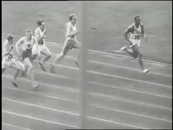 Adolf Hitler salutes at the opening ceremonies for the 1936 Berlin Olympic Summer Games where United States athlete Jesse Owens dominates the track and field events winning four gold medals. News Clip