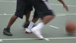 Two young men playing one on one basketball against one another. Stock Footage
