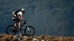 Mountain biker riding on the beautiful plateau Stock Footage