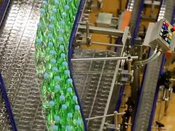 MS Shot of bottle moving in bottling plant at beverage industry / Gerolstein, Rhineland Palatinate, Germany  Stock Footage