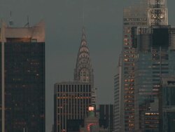 The lights of the Chrysler Building turn on. Stock Footage