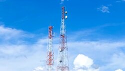 Time lapse of telecom pole with clouds move and blue sky background Stock Footage