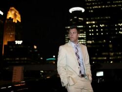 MS TU Well dressed young man standing next to his modern convertible car with confidence at night in urban area / Minneapolis, Minnesota, United States Stock Footage