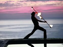 MS TU TD Reflection of dancing male poi dancer in pool water / Montezuma, Costa Rica Stock Footage