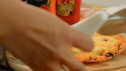 Hawaiian pizza served on a wooden tray Photo Brown. Stock Footage