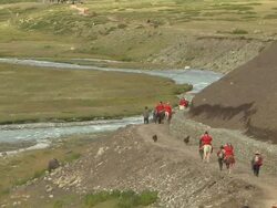 Pull Back Shot People on the circumambulation trail Lhasa Tibet China Stock Footage