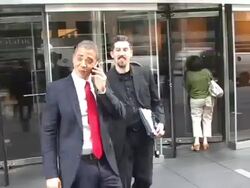 President Barack Obama impersonator Reggie Brown waves to photographers as he departs CNN in New York 06/20/11 (Footage by WireImage Video/Getty Images Entertainment Video) Stock Footage