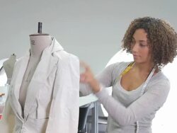 Portait of Female Fashion Designer working in studio Stock Footage