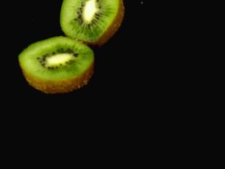 CU SLO MO Shot of Kiwi Fruits, actinidia chinensis, Slice rolling on Water and splashing / Calvados, Normandy, France Stock Footage