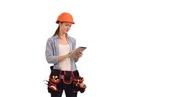 Beautiful young woman construction worker working on tablet Stock Footage