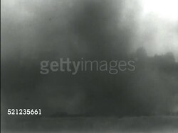 MOT 1939: BOMBING PRACTICE EXERCISES: DUSK: WS Tree line in silhouette w/ bomb exploding & large smoke plume rising FG. VS Bomb explosions, some fireball centers, lots of black smoke, AFTERNOON WS Bomb exploding in smoky field. AERIAL TU Boeing B-17 Bomber Instructional Video