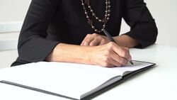 Businesswoman writing Stock Footage