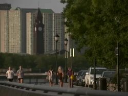 A group of joggers running down the waterfront sidewalk in Hoboken NJ Stock Footage