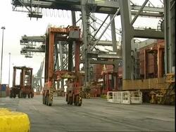 Crane vehicle moving across docks, Container Terminal, Southampton, UK Stock Footage