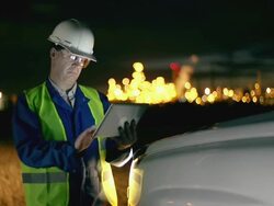 Engineer with tablet at industrial, oil or gas plant Stock Footage
