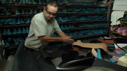 Shoemaker prepares to make boot. Stock Footage