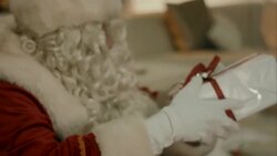 Santa Clause brings presents to kids Stock Footage