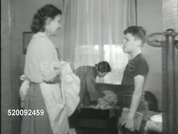 1951: GUIDANCE CENTER: DRAMATIZATION: 'Martha' in home cleaning in living room, brother coming into room, mother talking w/ brother (no SOT). * 'Martha' narrowing eyes SOT saying 'But you promised.'  Silly, Wacky. Instructional Video
