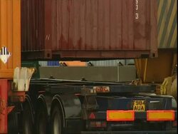 Container lowering on to lorry, Container Terminal, Southampton, UK Stock Footage