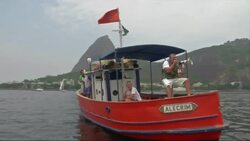 Boats fly black bands in protest at pollution in Guanabara bay News Clip
