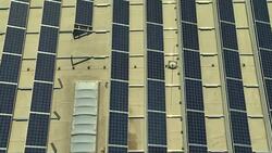 AERIAL Solar Panels On A Commercial Building Stock Footage