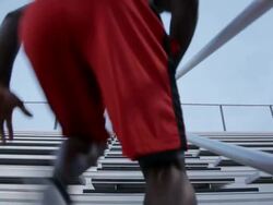 MS Young man working out and exercising on set of bleachers near field at dusk / Minneapolis, Minnesota, United States Stock Footage
