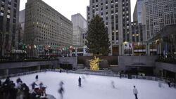 People ice skate in Rockefeller Plaza in New York City. Stock Footage