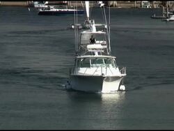 White Luxury Motor Boat Arrives / Travels Towards Camera Stock Footage