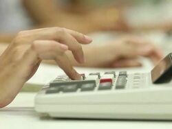 Punching numbers into a calculator Stock Footage