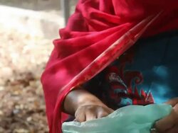 Woman getting coffee grains from a sack for coffee ceremony Stock Footage