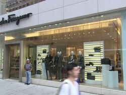 MS, Pedestrians passing by Salvatore Ferragamo store window display, New York City, New York, USA Stock Footage