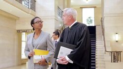 Judge and lawyer walking in courthouse Stock Footage