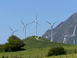 Wind farm, mountain in background, Spain Stock Footage