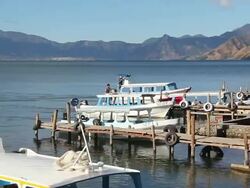 MS PAN Shot of boat in Atitlan Lake / Atitlan, Guatemala Stock Footage
