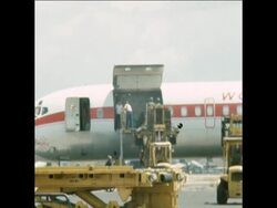 SYND 17 2 75 AMMUNITION FROM THE US BEING UNLOADED AT PNNOM PENH AIRPORT News Clip