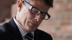 Financial advisor and restaurant owner go over paperwork at business meeting Stock Footage