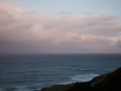 WS  T/L  View of Pink clouds moving in blue sky at sunset / Big Sur, California, United States Stock Footage