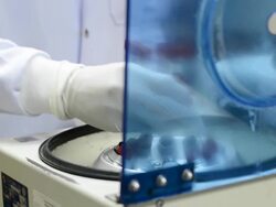 scientist using blood centrifuge. Stock Footage